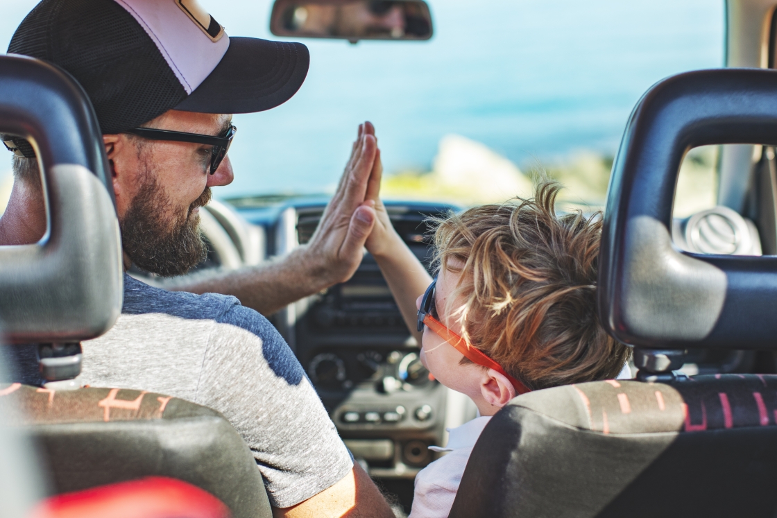 Father and son in car